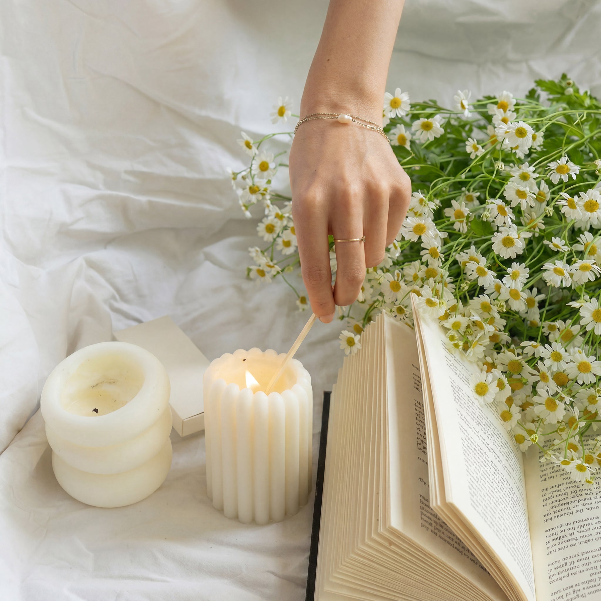 LLIOR Pillar Candle I and II lit warm flame sculptural natural wax candles
