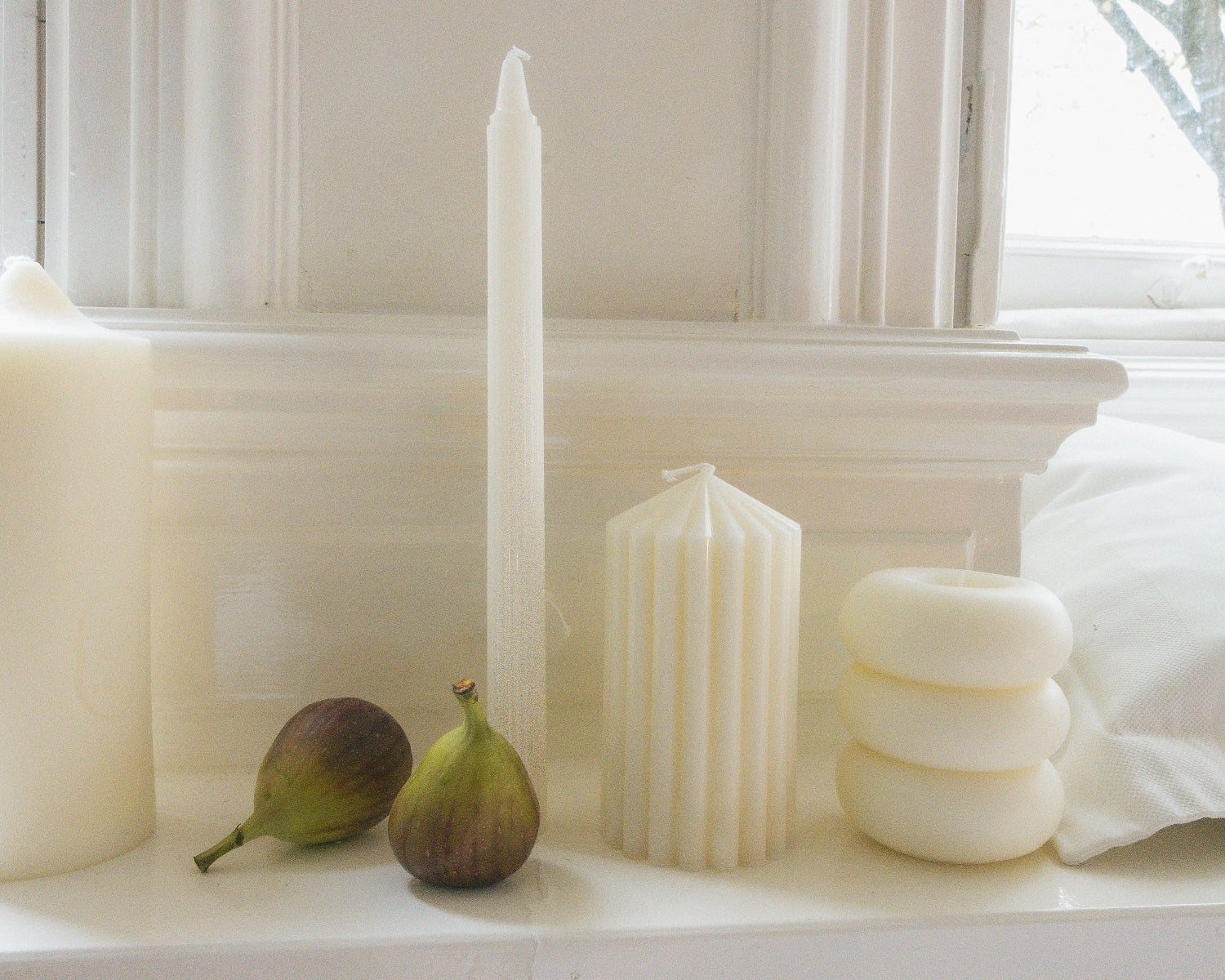 LLIOR seasonal candle collection sculptural pillar and taper candles natural wax