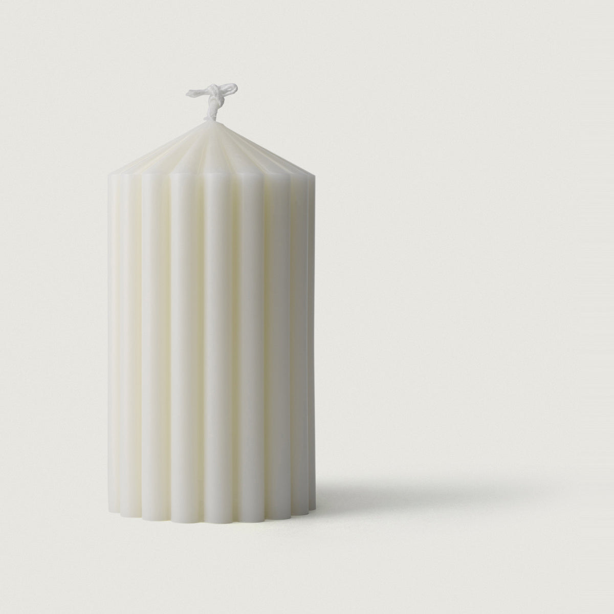 LLIOR Pillar Candle II, a fluted pillar candle poured from a 50/50 blend of beeswax and soy wax, unscented