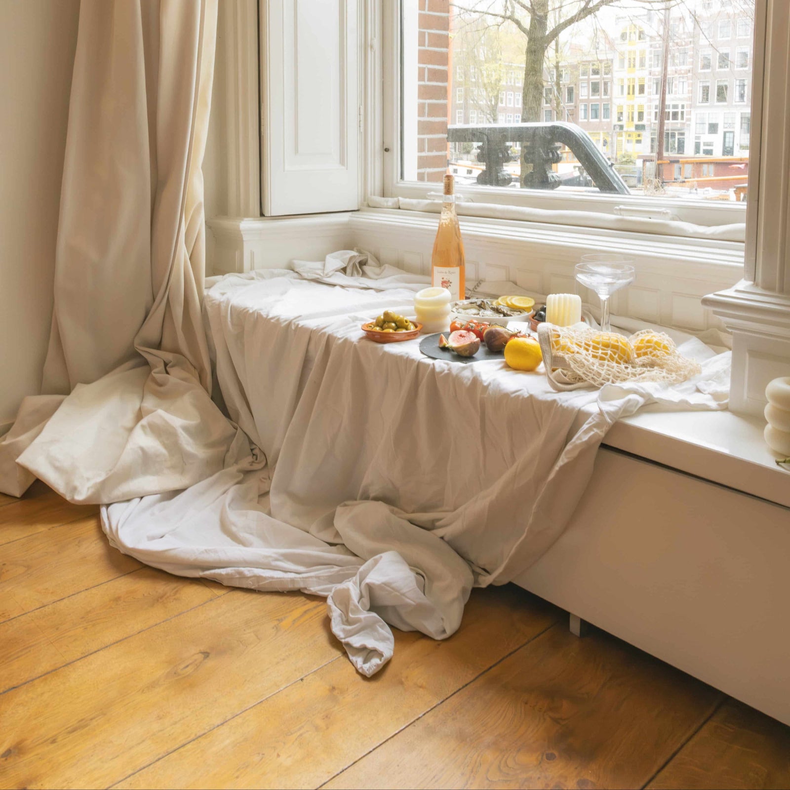 LLIOR candles in Amsterdam interior warm natural light by window Netherlands