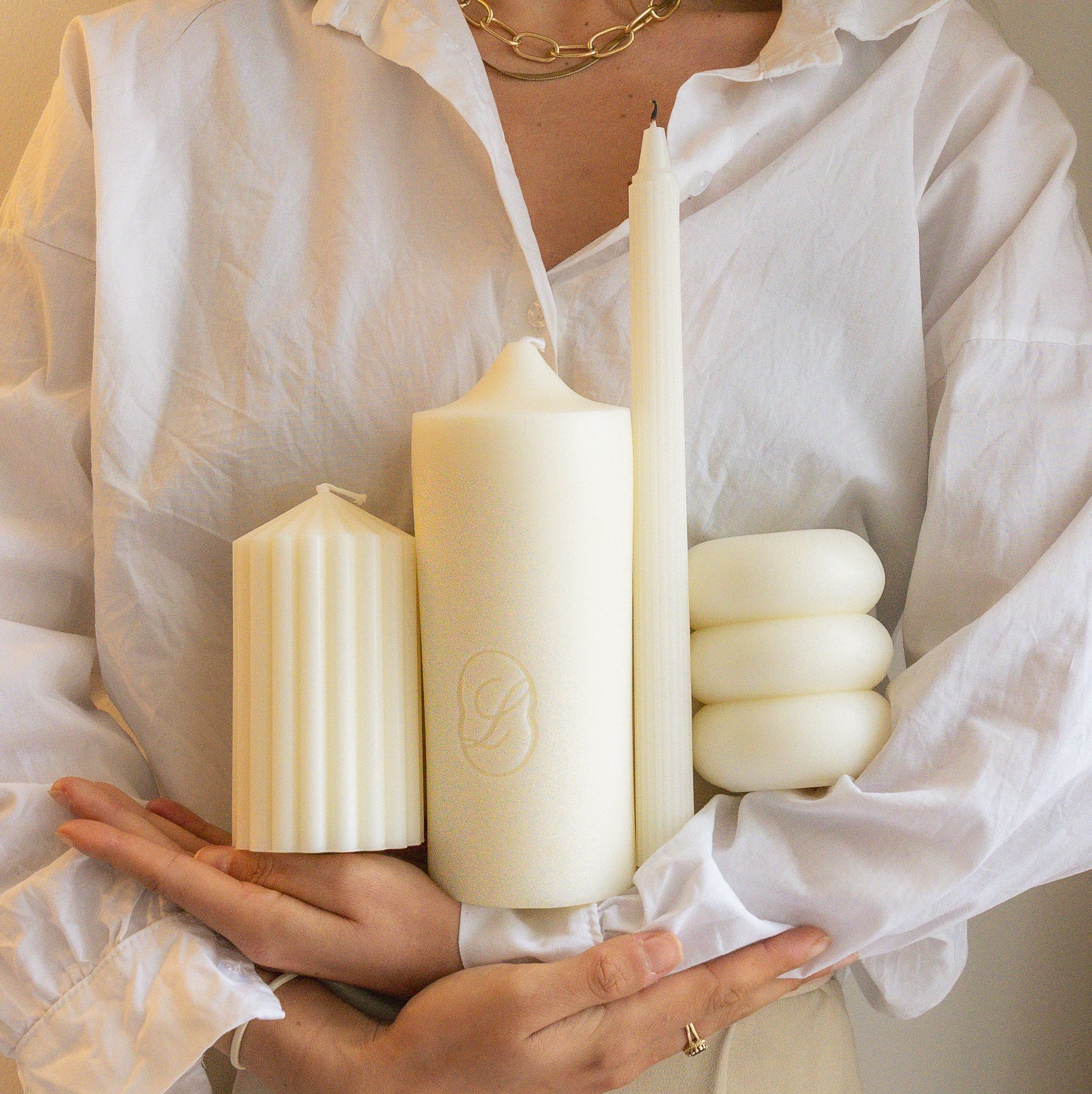 Hands holding LLIOR Edition No 01 sculptural candles beeswax soy natural wax