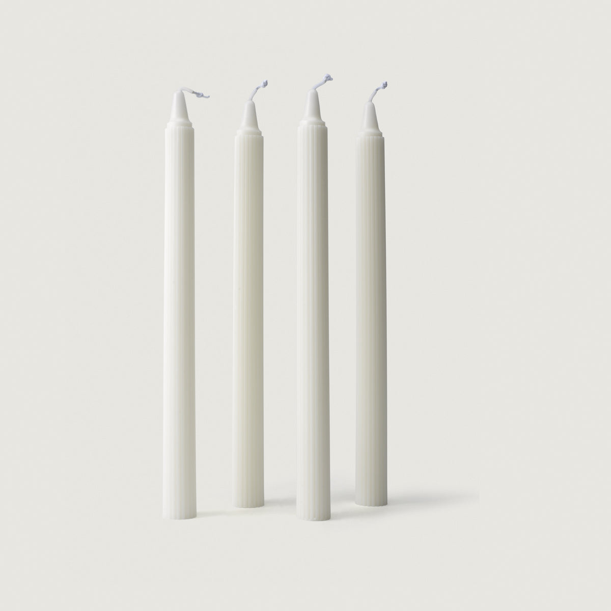 Four LLIOR taper candles in soy wax, 27 cm, ribbed, unscented