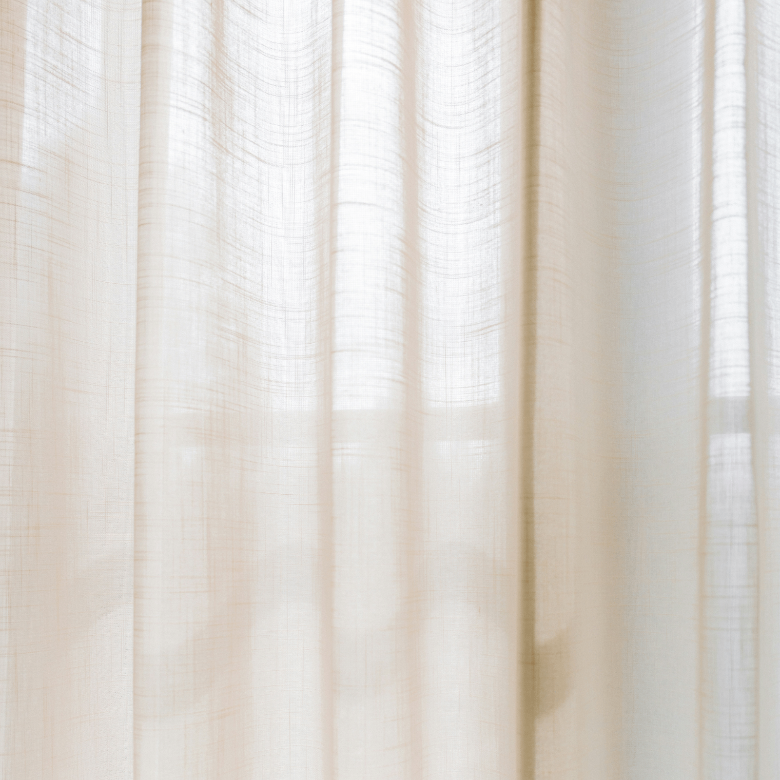 Warm natural light through linen curtain LLIOR homepage